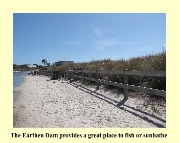 The Earthen Dam provides a great place to fish or sunbathe